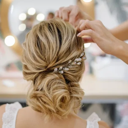 Soft low updo with a hair comb